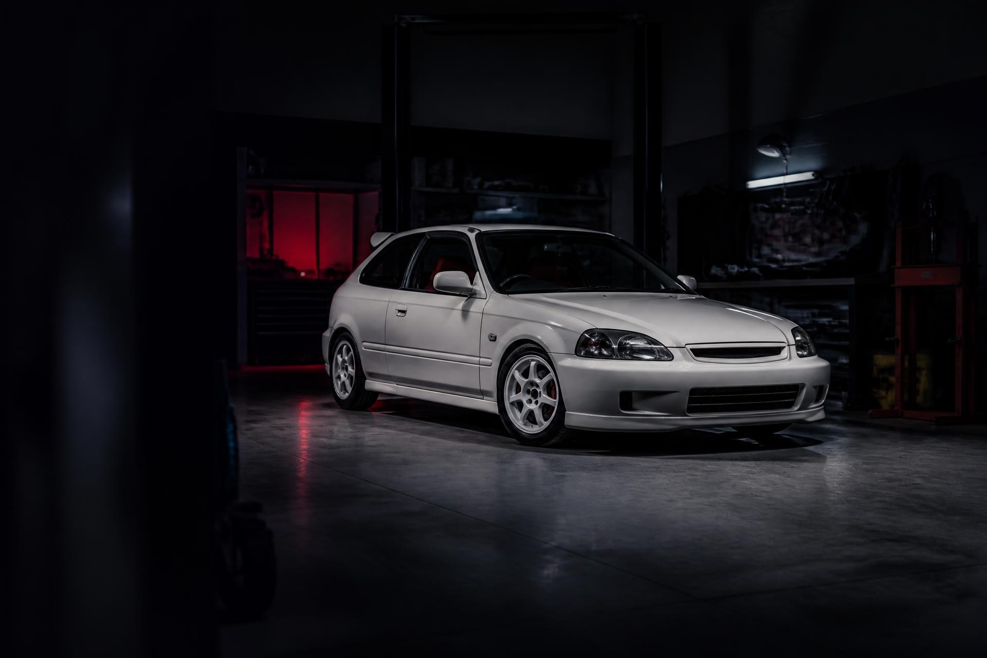 Japanese performance hatchback inside a professional repair garage